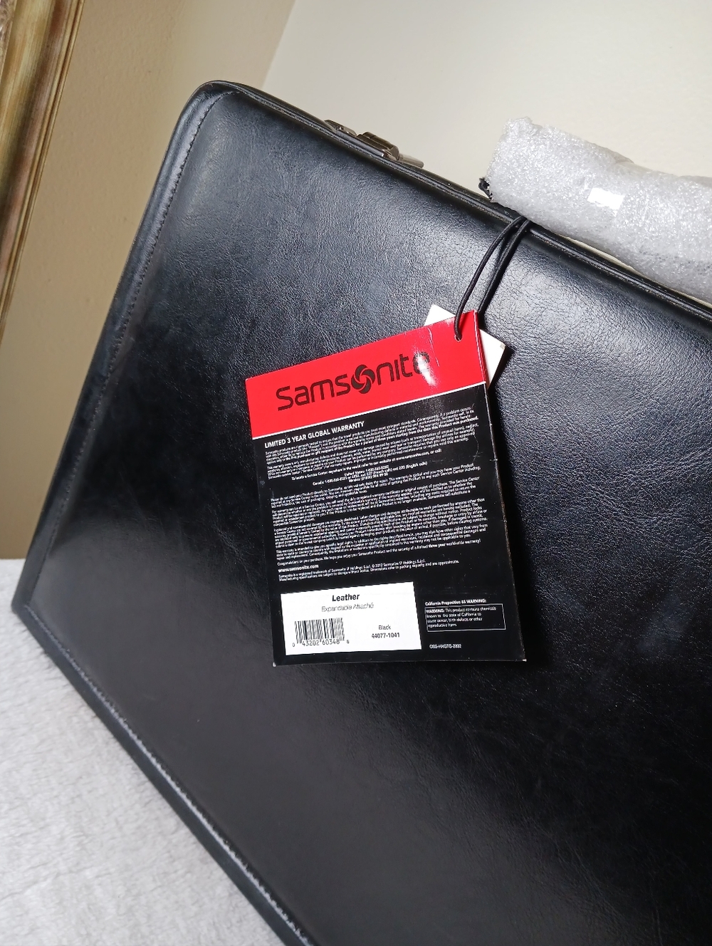 Samsonite Black Leather Briefcase with Red Tag